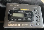 Sony Walkman WM-FX42 & Black Jvc Headphones. Fixed Price $45.00.