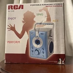 Rca (RK-1248) Silver / Blue Portable Karaoke Stereo With Camera & Microphone. Fixed Price $29.99.