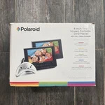 Polaroid DPA-08055S 8" Two Screen Portable Dvd Player W/ 15-IN-1 Game Controller. Fixed Price $59.99.