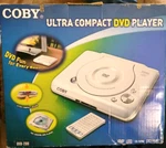 Coby Ultra Compact New Player Model: DVD-209 Slim Design Top Load. Fixed Price $21.64.