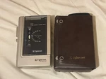 Cybernet Intimate-ii PS-103 Pocket Cassette Tape Player W/ Tuner & Case. Fixed Price $80.00.