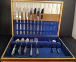 Interpur Cortina Stainless Flatware Set Two Toned Wood Box 40PC Glossy. Fixed Price $55.97.