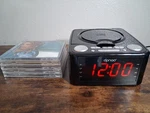 Dpnao Clock Radio Alarm Player Fm Usb Digital Bedside Stereo W/ 5 Cds. Fixed Price $39.99.