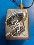 Extra Clean Sony Walkman Cassette Player WM-FX281, With Orange Headphones. Fixed Price $129.99.