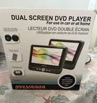 Sylvania Dual Screen Portable Player Model SDVD9957 (new). Fixed Price $80.00.