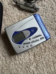 Sharp MD-SR60 Portable Minidisc Recorder With Remote Control, Tdk MD-XG74. Fixed Price $150.00.
