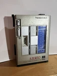 Toshiba Kt VS1 Metal Cassette Player, BP-D2 Battery Case,, Belt Clip, Untested. Fixed Price $39.00.